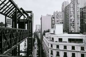 Monochrome view of Santiago's highrise buildings and urban streetscape.