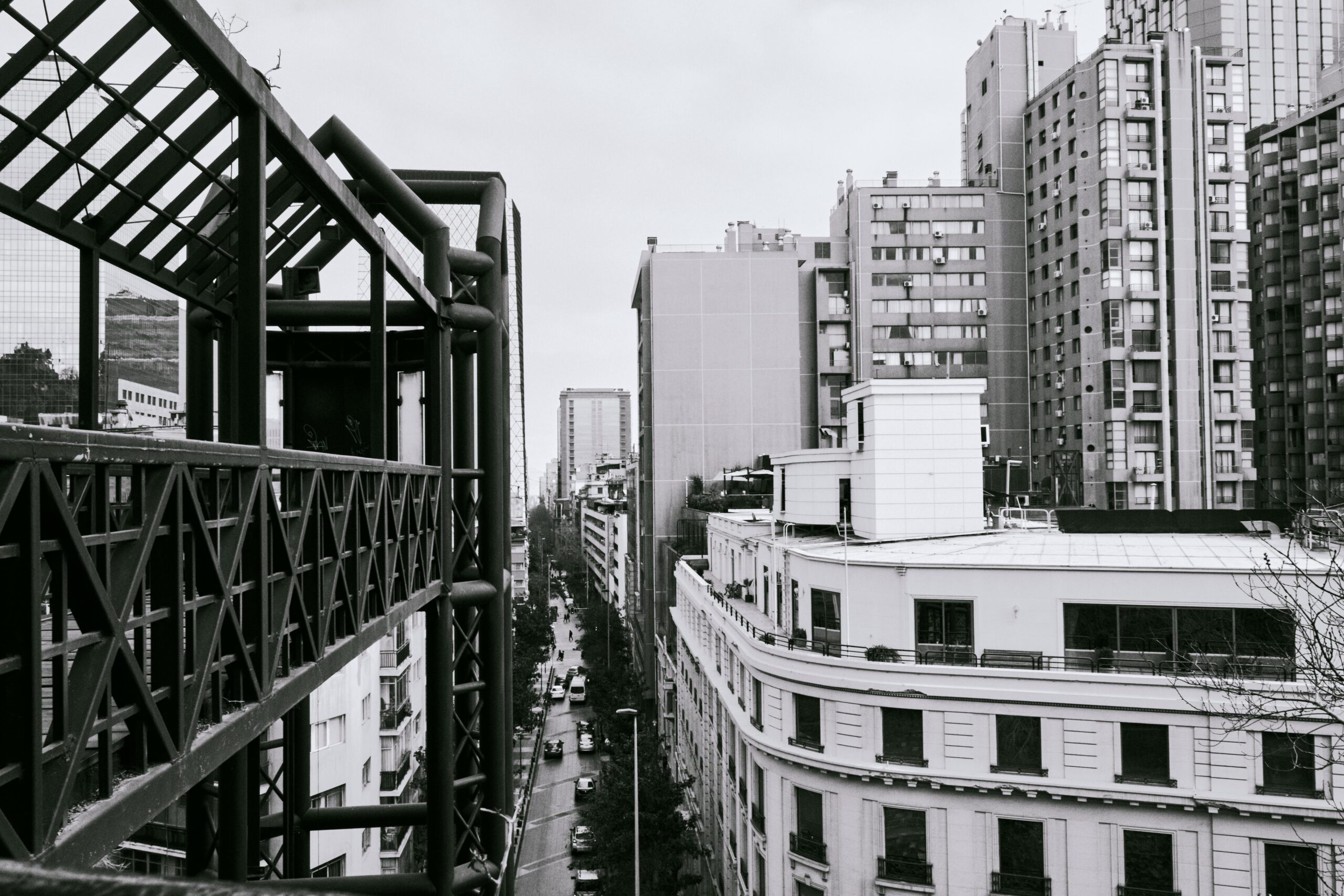 Monochrome view of Santiago's highrise buildings and urban streetscape.