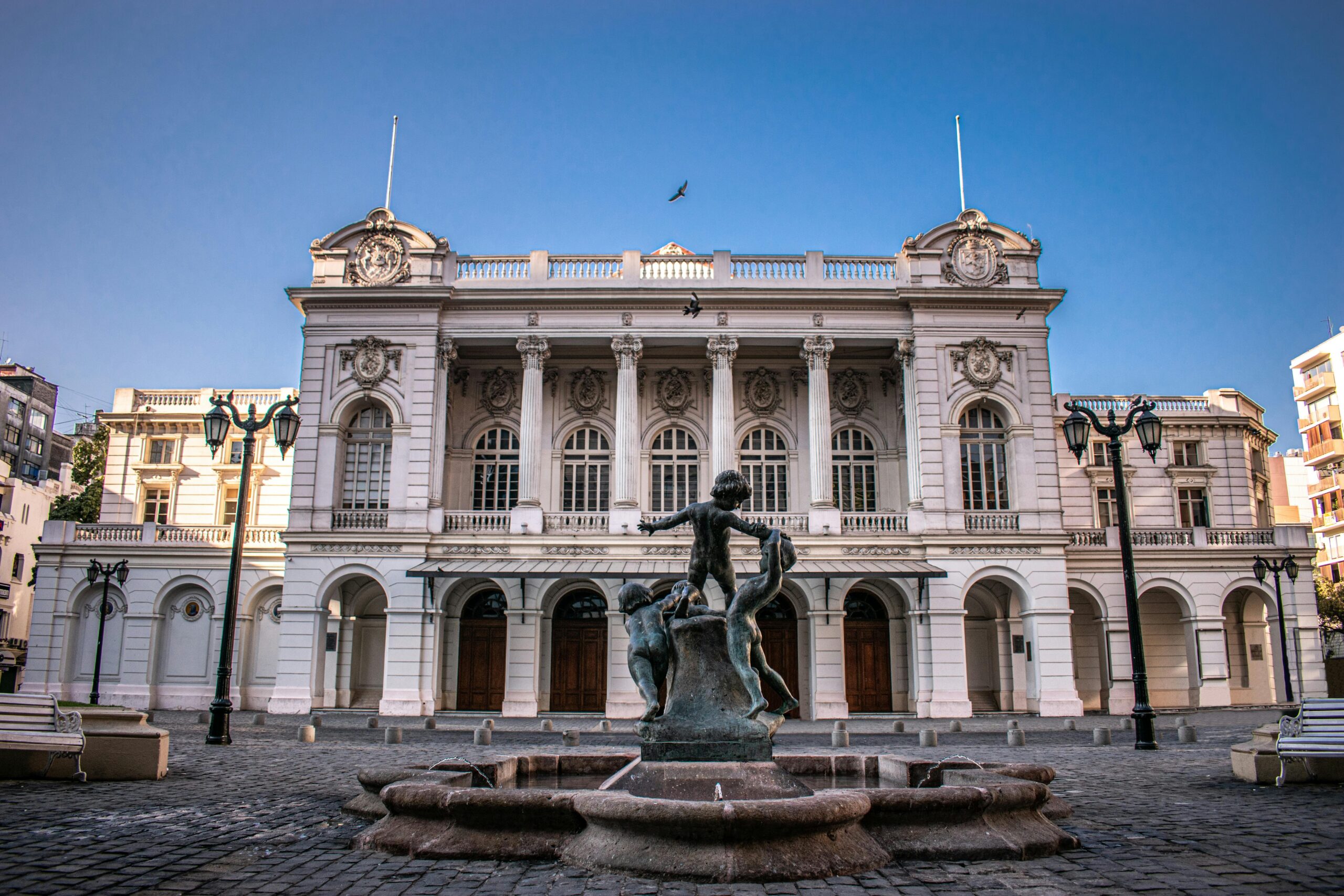 Elegant view of the historic Municipal Theatre in Santiago, Chile with a central fountain.