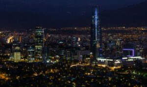 A captivating cityscape featuring glowing skyscrapers and bright city lights at night.